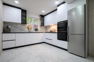 A recently renovated kitchen with sleek, modern appliances