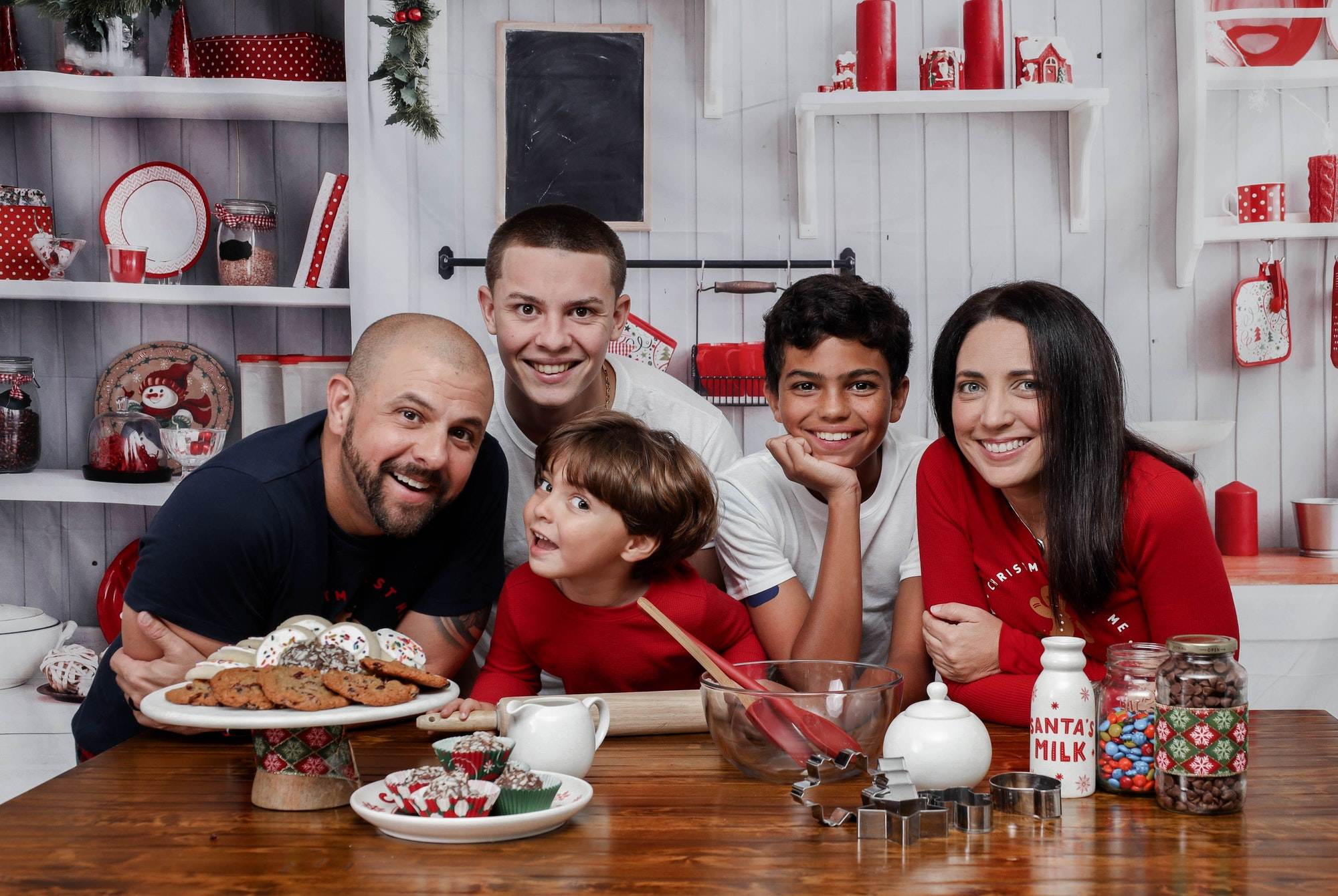 Happy family together in a kitchen during the Christmas holiday - the concept of family traditions