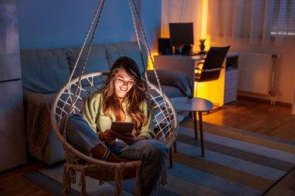 Woman reading an ebook at home